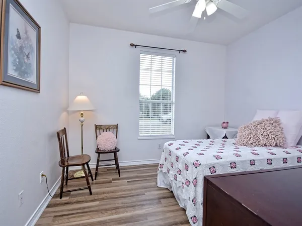 a bedroom with a bed and a table