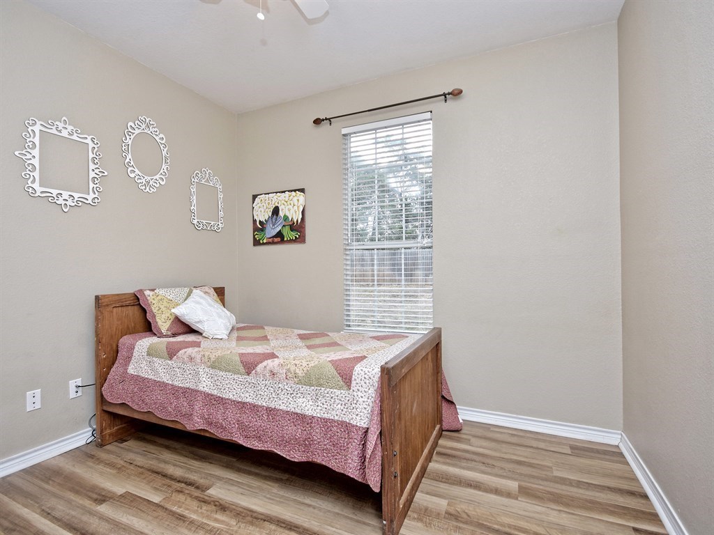 600 Grand Prairie Circle Dripping Springs, TX 78620 - Photo 16 of 25 a bed room with a bed and a window