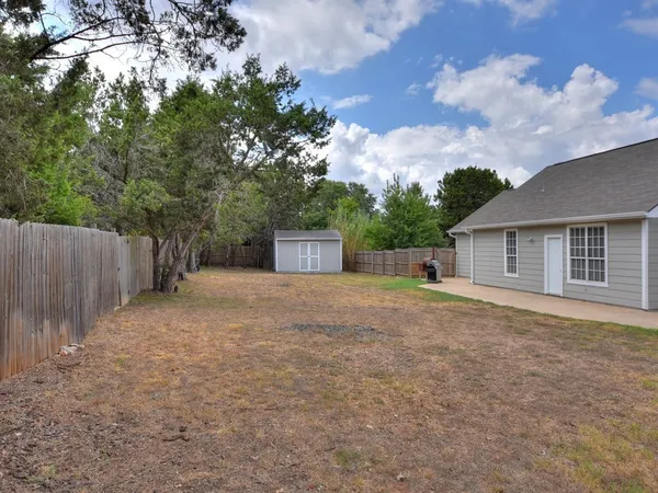 a house view with a backyard space