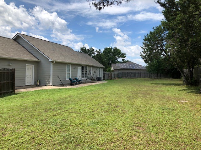 600 Grand Prairie Circle Dripping Springs, TX 78620 - Photo 21 of 25 a front view of a house with a garden