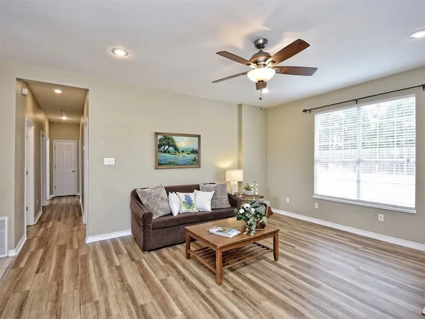 a living room with furniture and a window