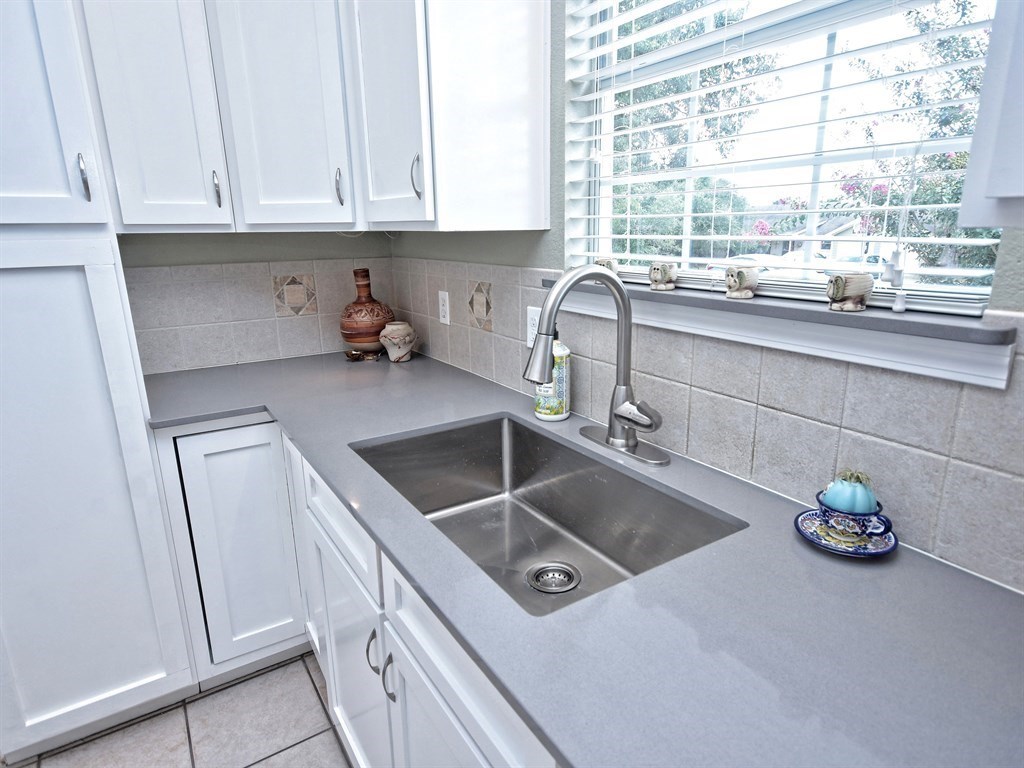 600 Grand Prairie Circle Dripping Springs, TX 78620 - Photo 8 of 25 a kitchen that has a sink and a stove