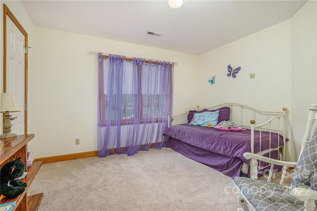 463 Cranborne Chase Fort Mill, SC 29708 - Photo 34 of 48 a bed room with a bed and a window