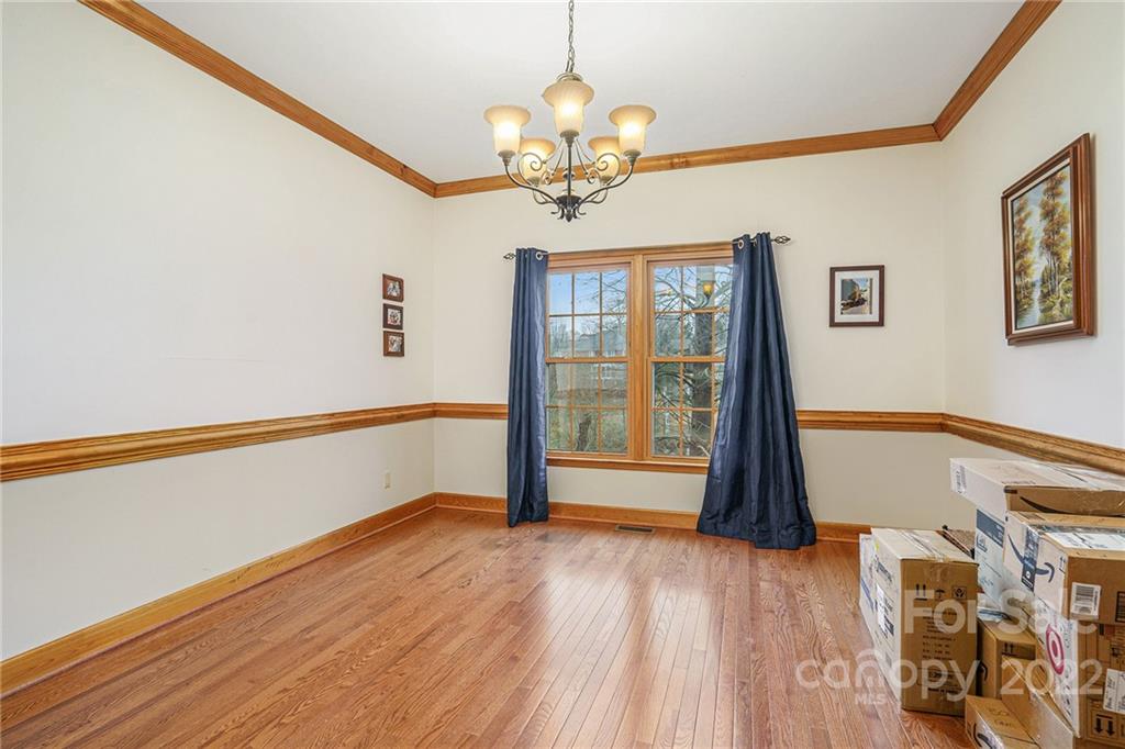 463 Cranborne Chase Fort Mill, SC 29708 - Photo 8 of 48 a view of an empty room with a window and wooden floor