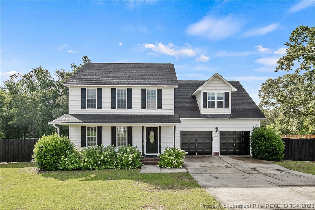 244 Rockingham Street Spring Lake, NC 28390 - Photo 1 of 34 a front view of a house with a yard