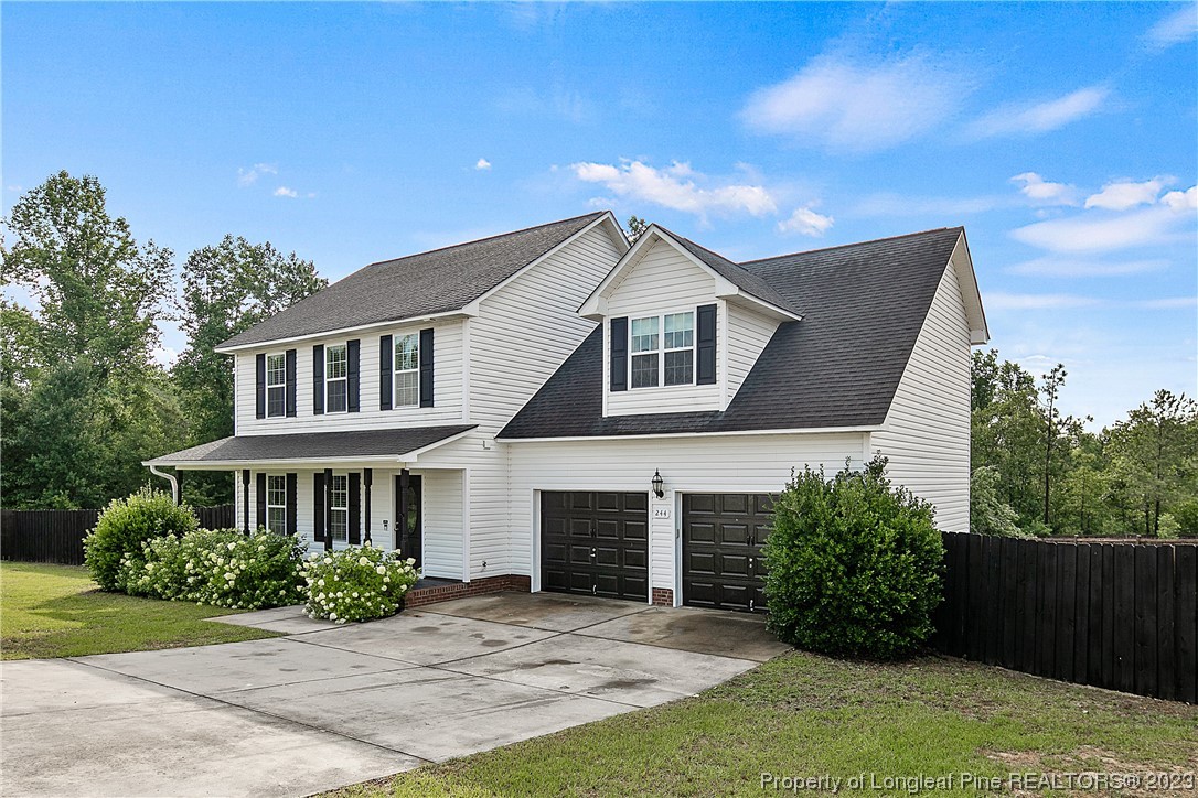 244 Rockingham Street Spring Lake, NC 28390 - Photo 2 of 34 a front view of a house with a yard