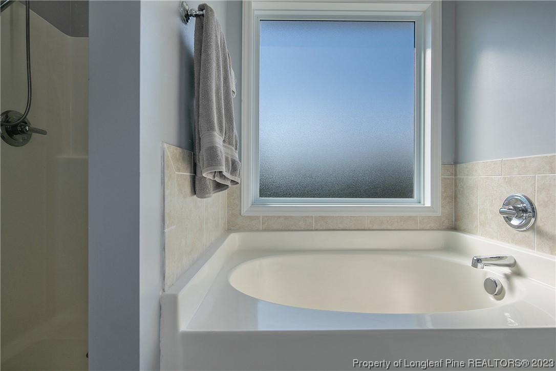 244 Rockingham Street Spring Lake, NC 28390 - Photo 26 of 34 a bathroom with a bathtub