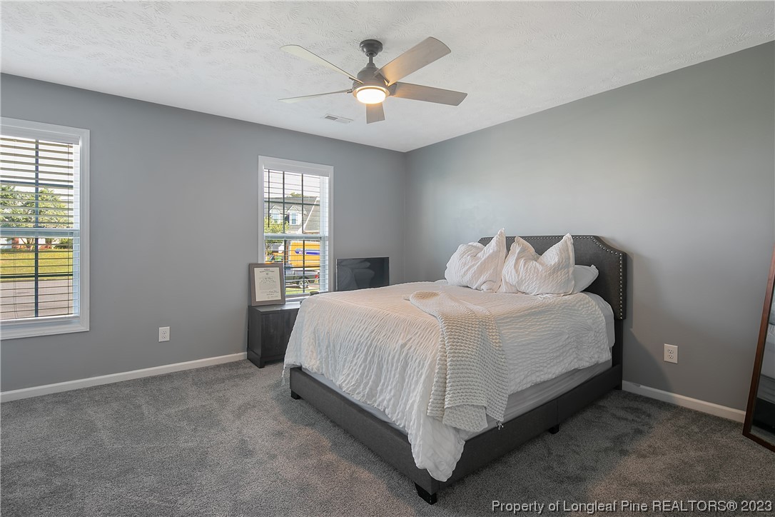 244 Rockingham Street Spring Lake, NC 28390 - Photo 27 of 34 a bedroom with a bed and window