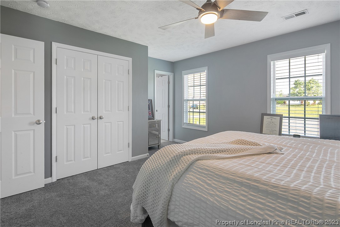 244 Rockingham Street Spring Lake, NC 28390 - Photo 30 of 34 a bedroom with a bed and window