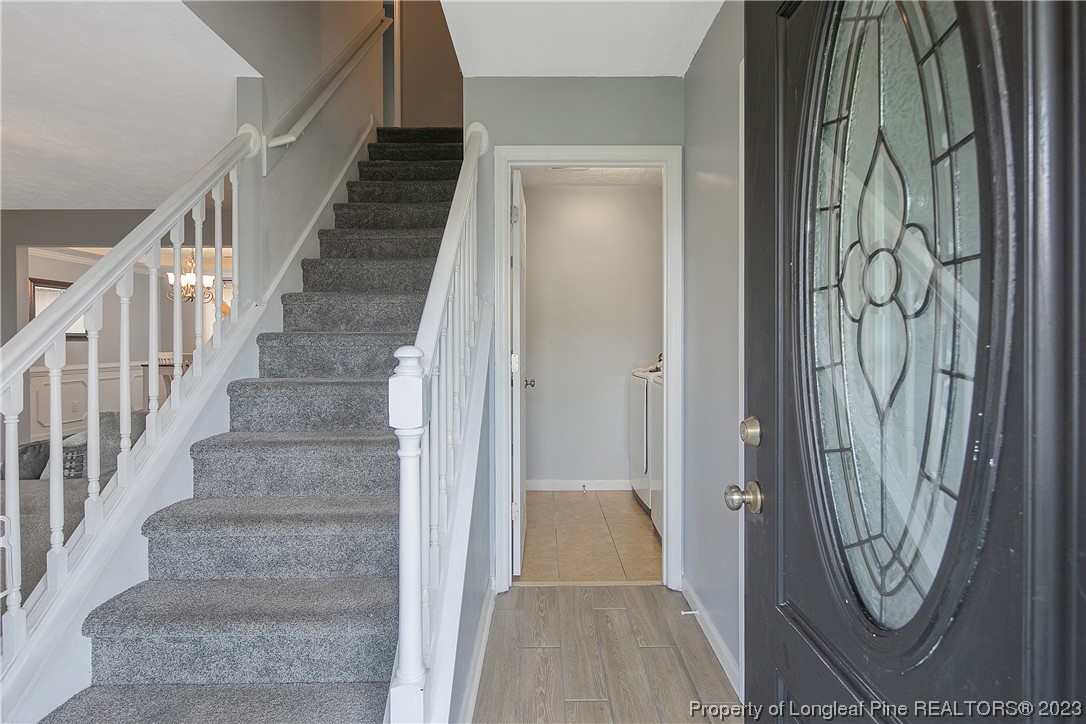 244 Rockingham Street Spring Lake, NC 28390 - Photo 4 of 34 a view of a hallway with wooden floor and entryway