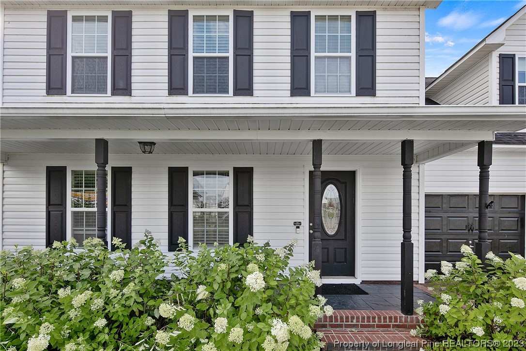 244 Rockingham Street Spring Lake, NC 28390 - Photo 5 of 34 a front view of a house with a garden