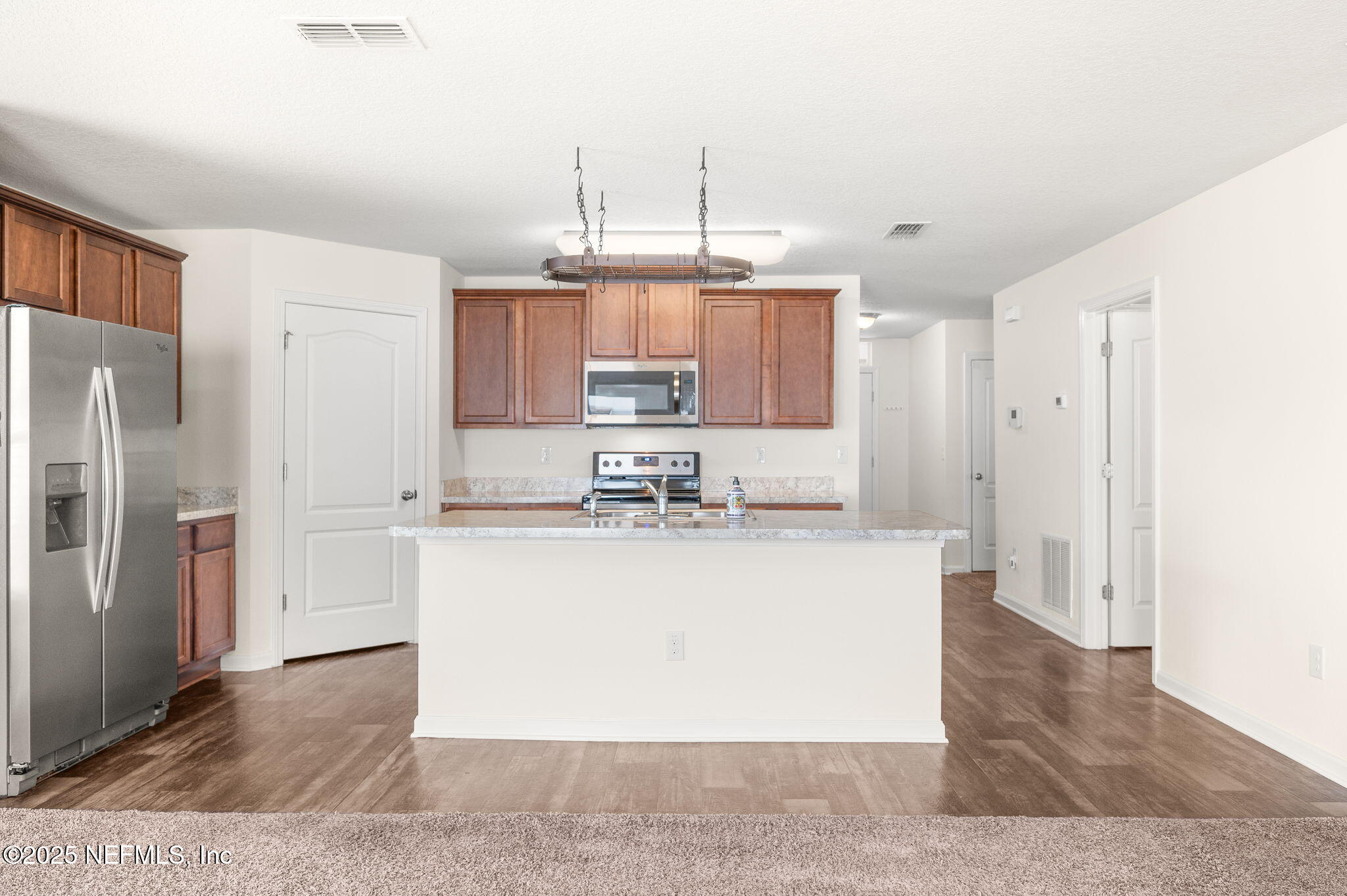 146 Blue Creek Way St. Augustine, FL 32086 - Photo 11 of 38 a large kitchen with stainless steel appliances granite countertop a refrigerator a stove a sink and a refrigerator