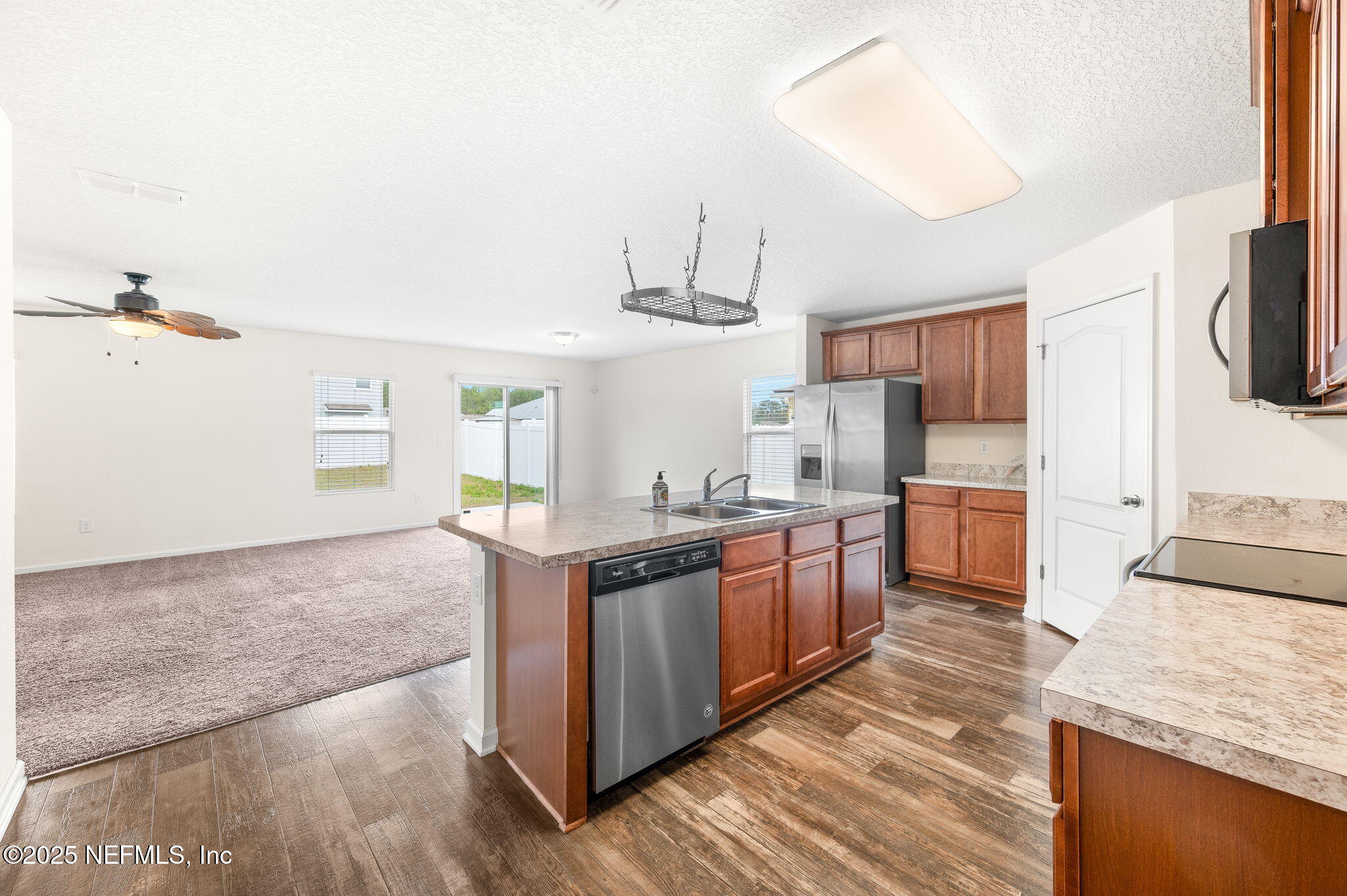 146 Blue Creek Way St. Augustine, FL 32086 - Photo 14 of 38 a kitchen with stainless steel appliances granite countertop a stove a sink dishwasher and a refrigerator