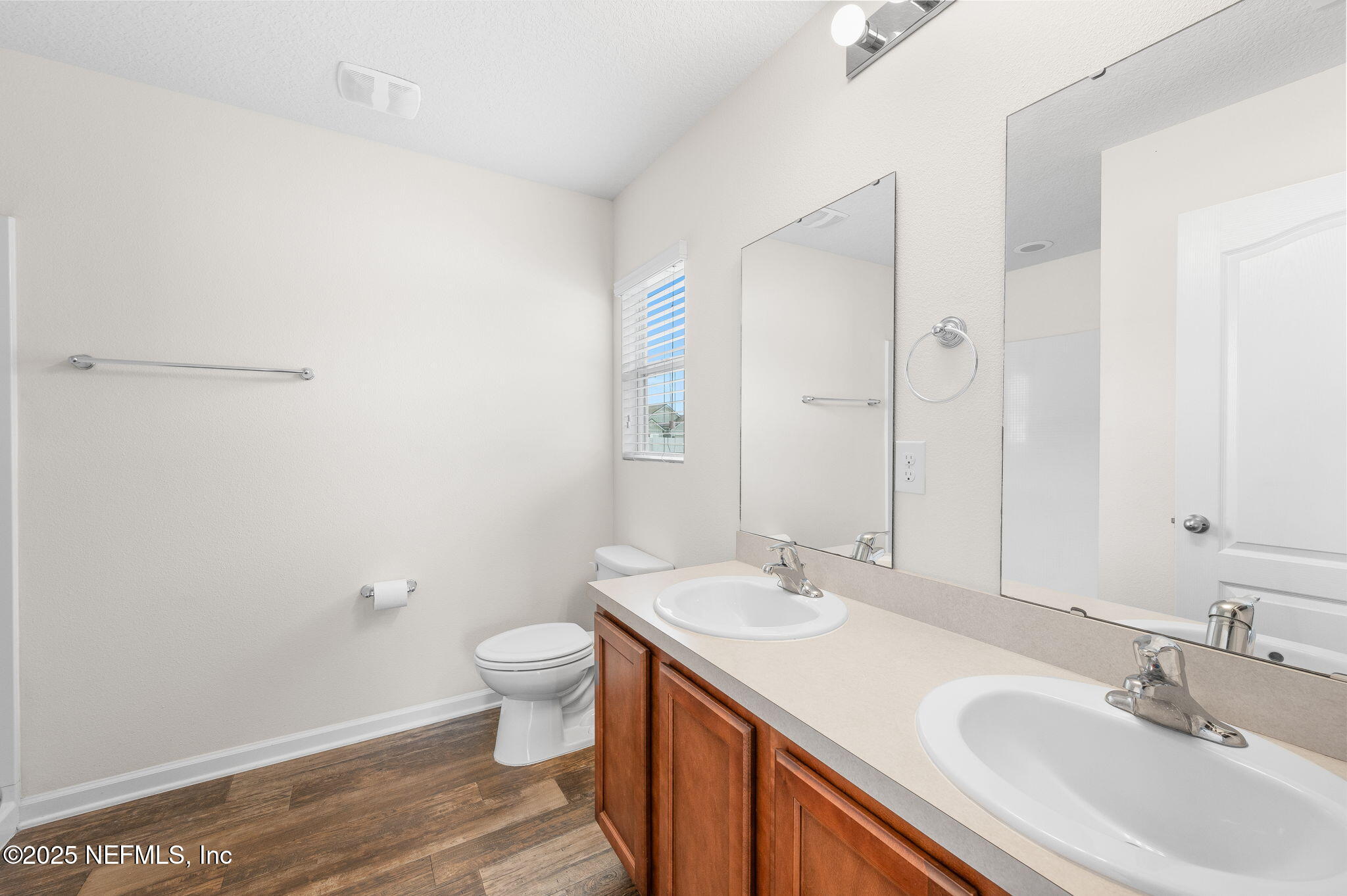 146 Blue Creek Way St. Augustine, FL 32086 - Photo 20 of 38 a bathroom with a sink a toilet and a mirror