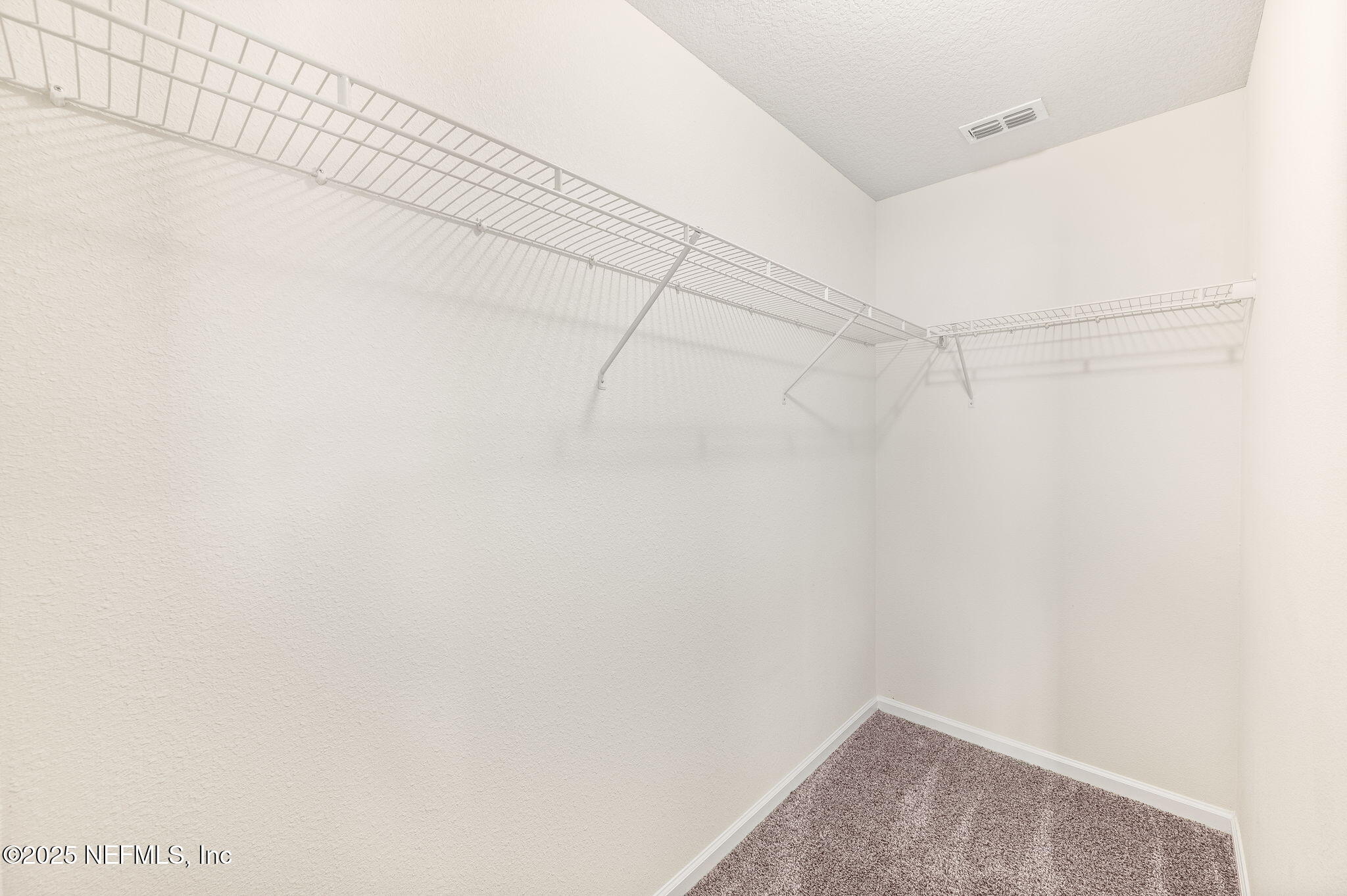 146 Blue Creek Way St. Augustine, FL 32086 - Photo 23 of 38 a view of a room with racks on the wall