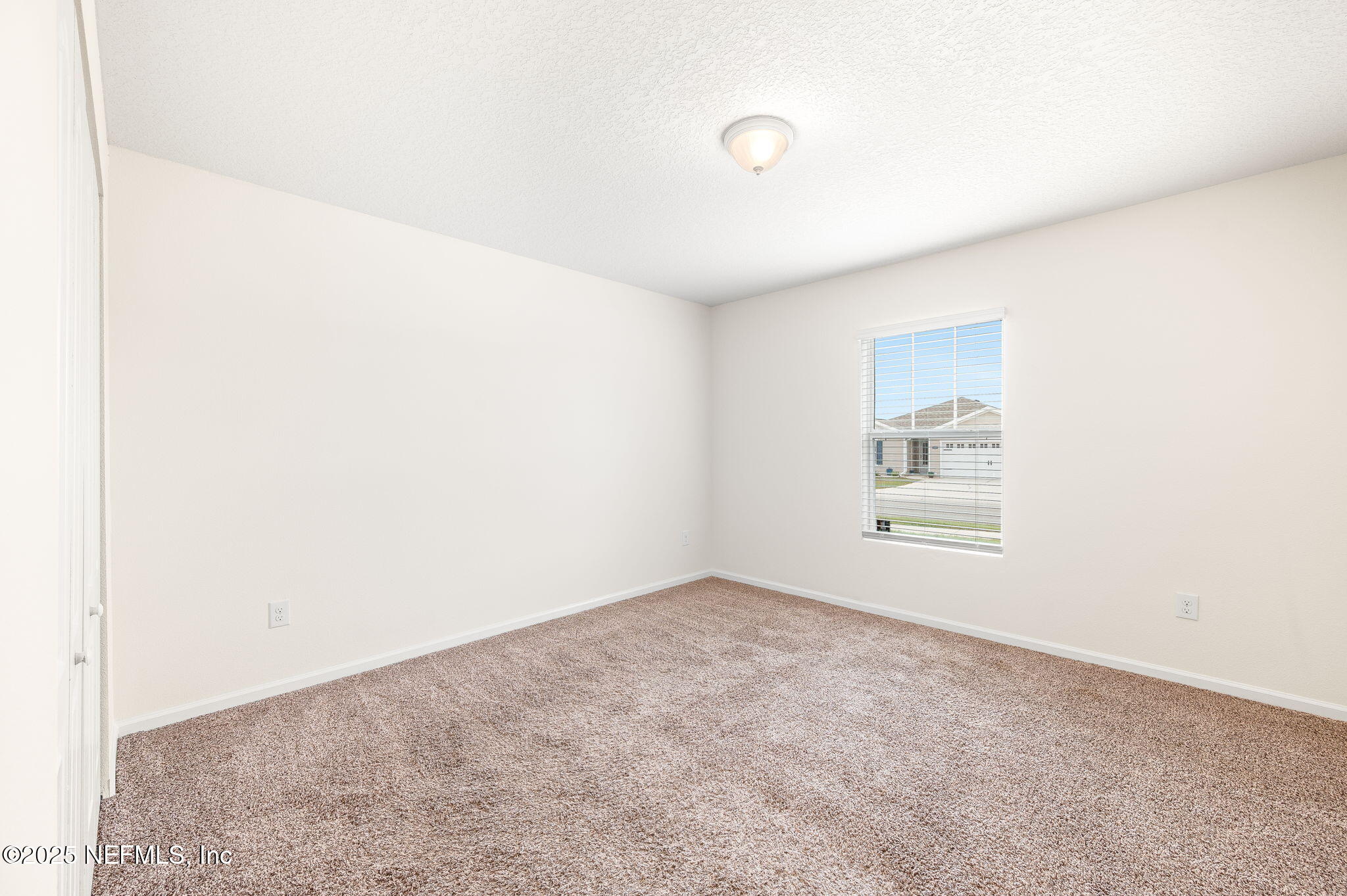 146 Blue Creek Way St. Augustine, FL 32086 - Photo 25 of 38 an empty room with windows