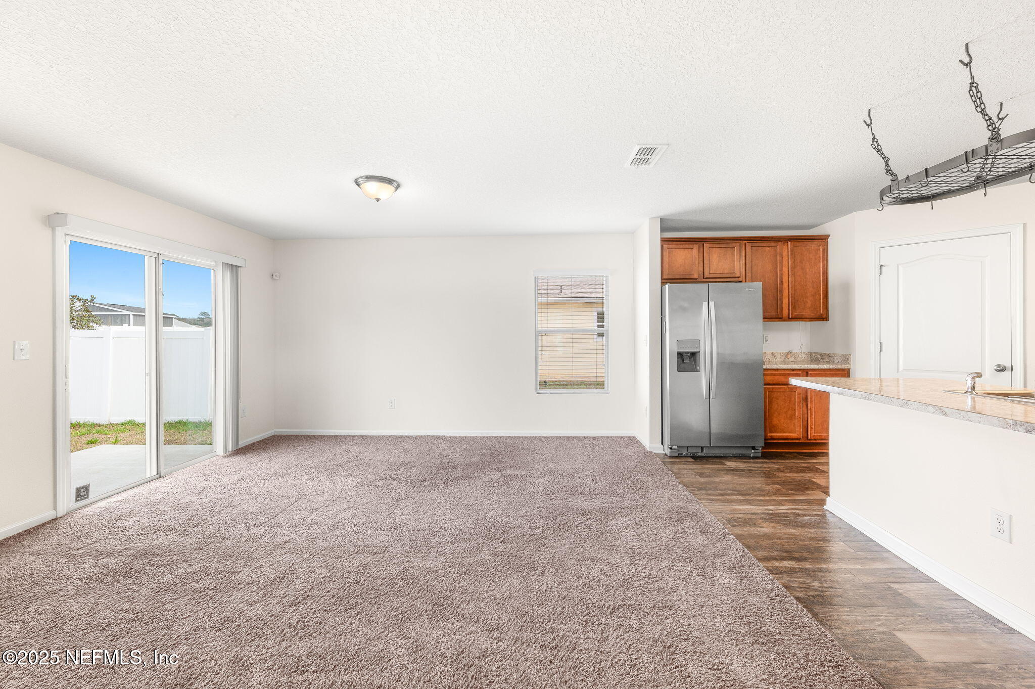 146 Blue Creek Way St. Augustine, FL 32086 - Photo 3 of 38 a view of a kitchen with refrigerator and a stove
