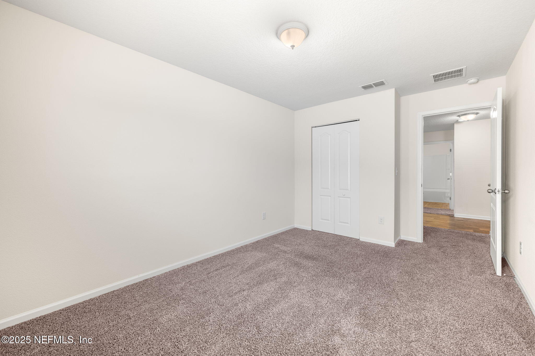 146 Blue Creek Way St. Augustine, FL 32086 - Photo 31 of 38 an empty room with an entryway