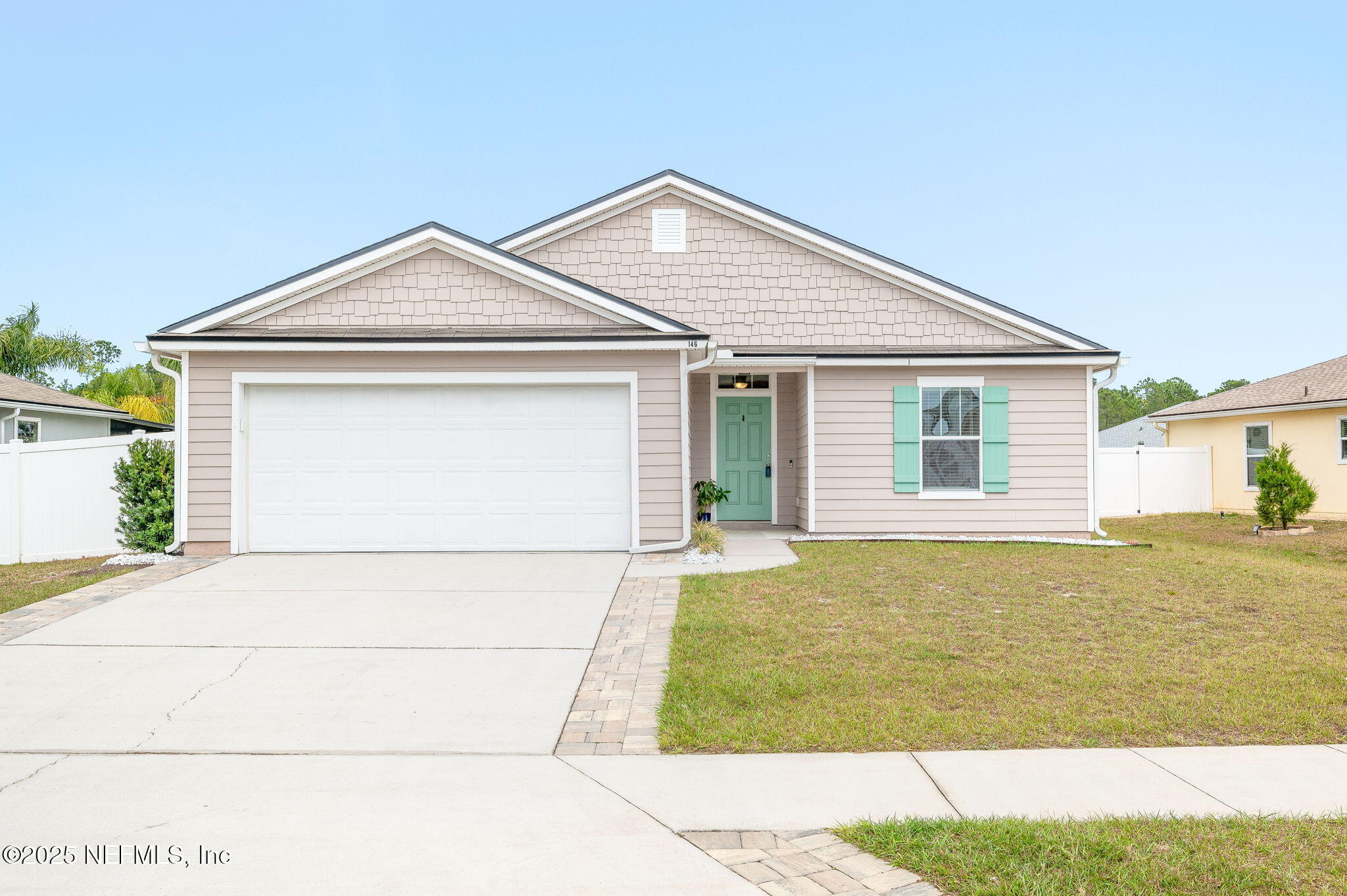 146 Blue Creek Way St. Augustine, FL 32086 - Photo 38 of 38 a front view of a house with a garden