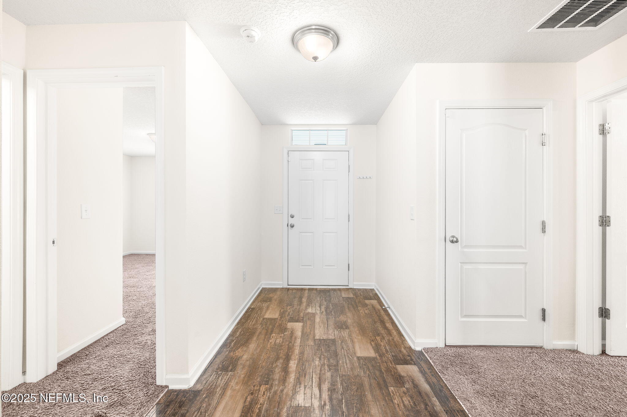 146 Blue Creek Way St. Augustine, FL 32086 - Photo 4 of 38 a view of a room with wooden floor and bathroom