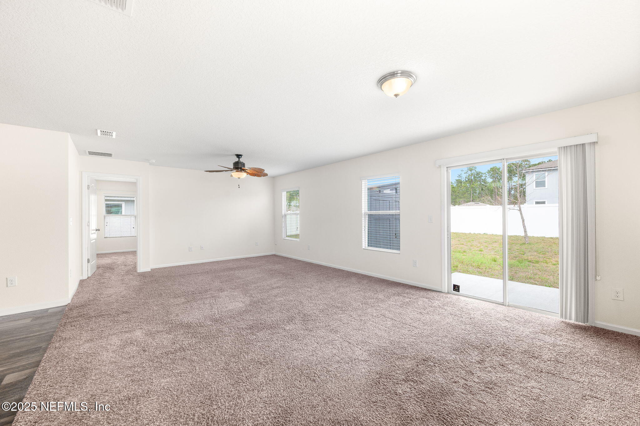 146 Blue Creek Way St. Augustine, FL 32086 - Photo 5 of 38 an empty room with windows and closet