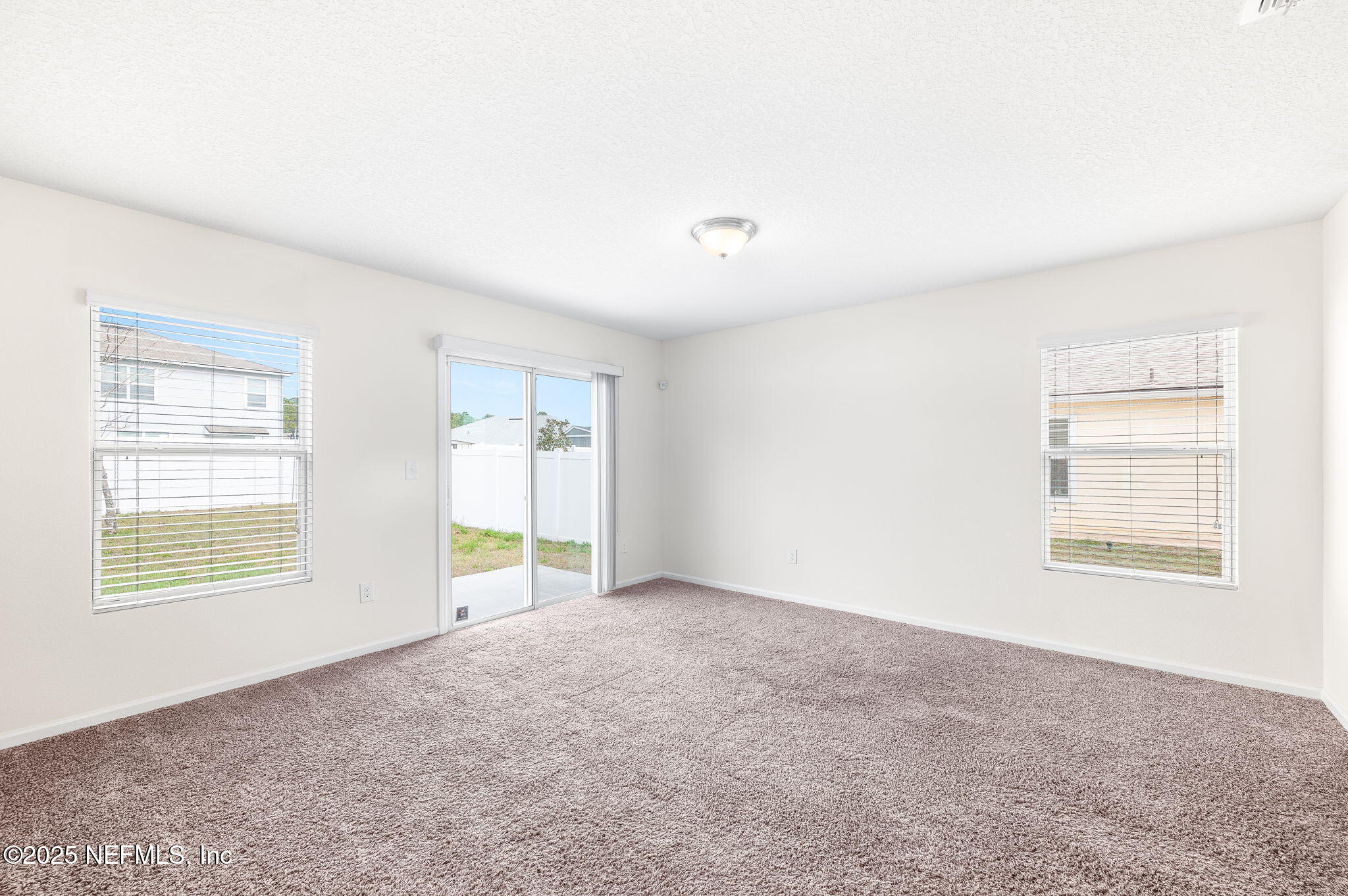 146 Blue Creek Way St. Augustine, FL 32086 - Photo 7 of 38 an empty room with windows