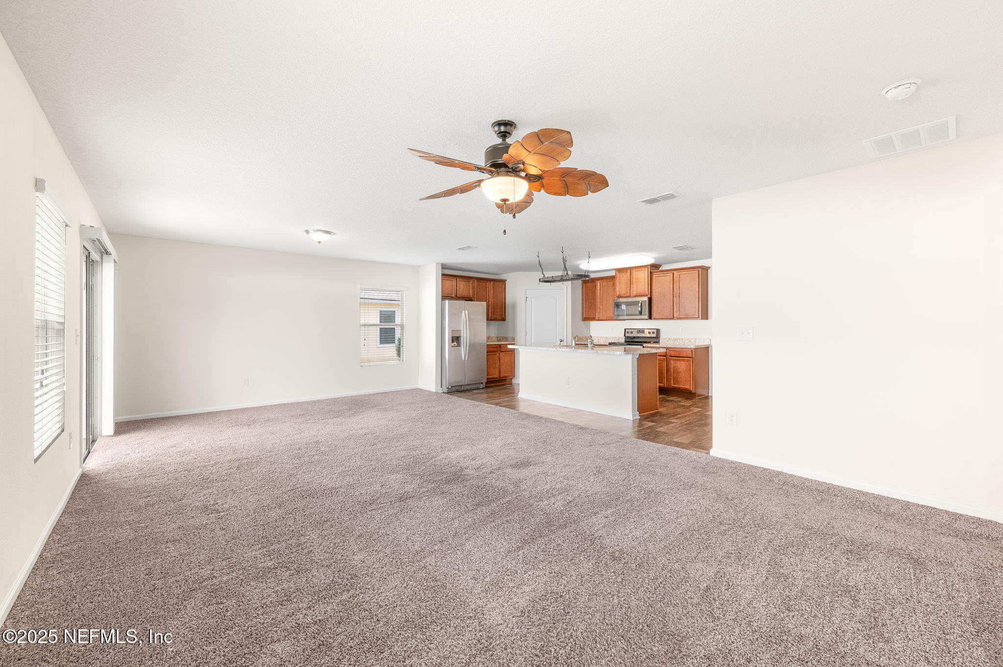 146 Blue Creek Way St. Augustine, FL 32086 - Photo 9 of 38 a view of a kitchen with a sink and a cabinet