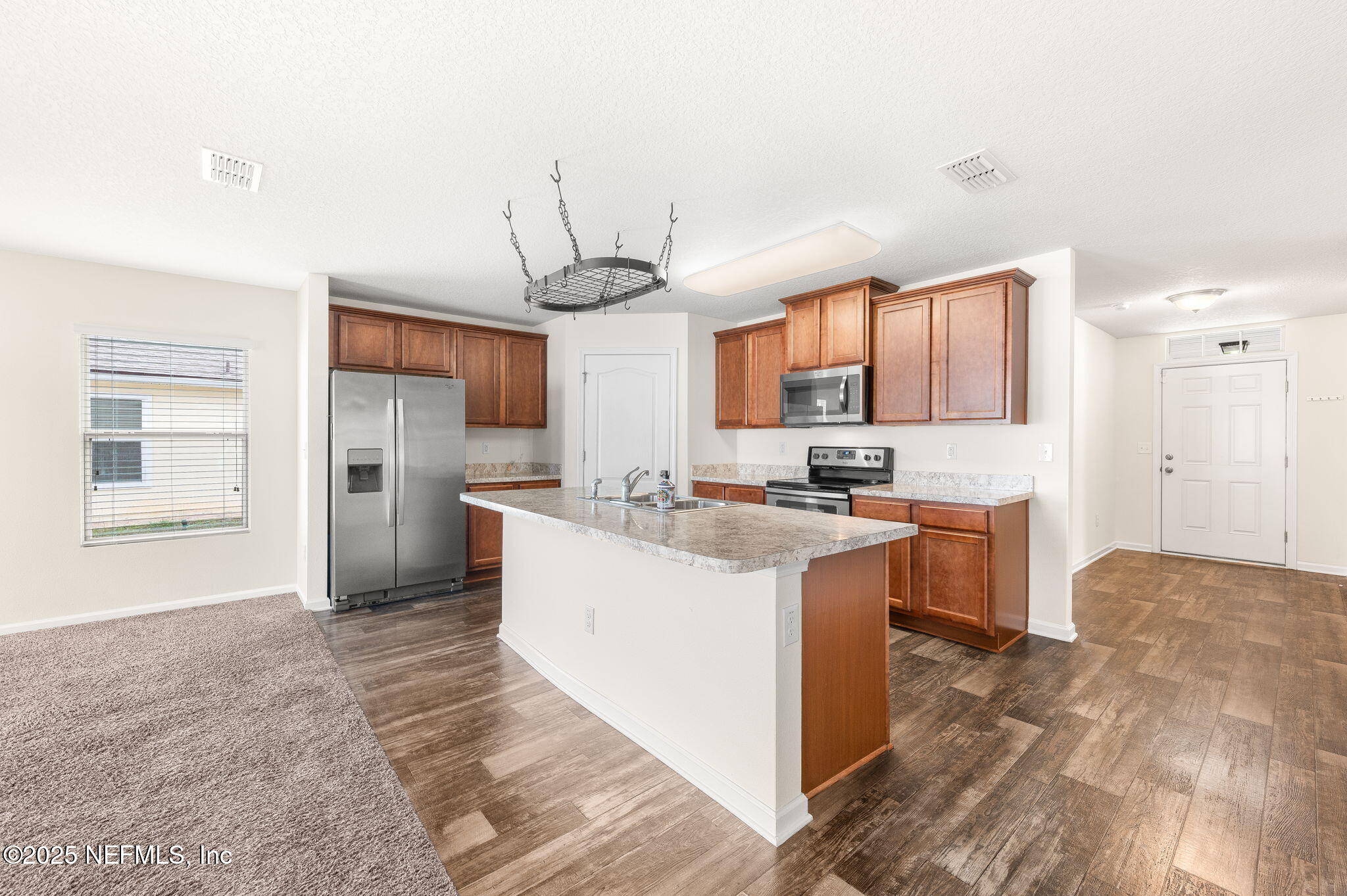 146 Blue Creek Way St. Augustine, FL 32086 - Photo 10 of 38 a kitchen with stainless steel appliances granite countertop a sink stove and refrigerator