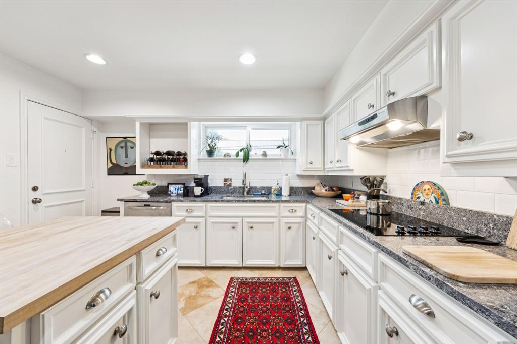 6227 Bandera Avenue, Unit D Dallas, TX 75225 - Photo 7 of 16 a kitchen with stainless steel appliances granite countertop a sink and cabinets