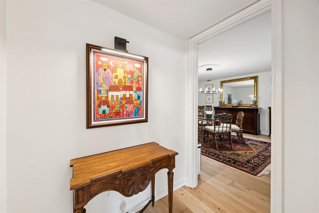 6227 Bandera Avenue, Unit D Dallas, TX 75225 - Photo 8 of 16 a room with furniture mirror and a window