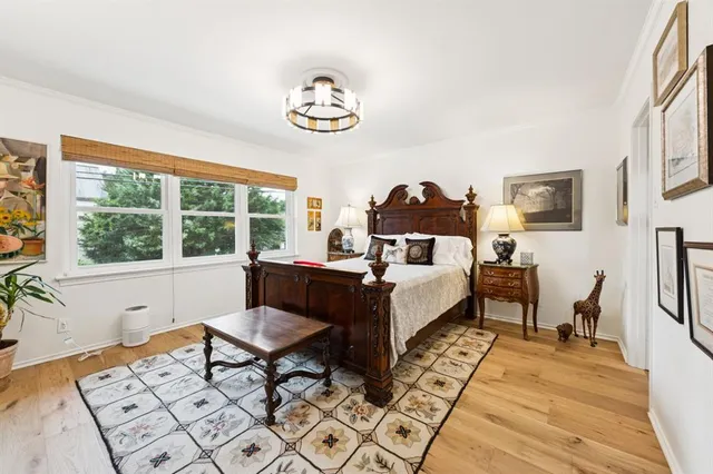 a bedroom with a bed and a table in it