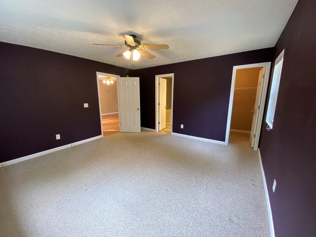 501 Hardy Road LaGrange, GA 30241 - Photo 16 of 37 a view of an empty room with a chandelier fan