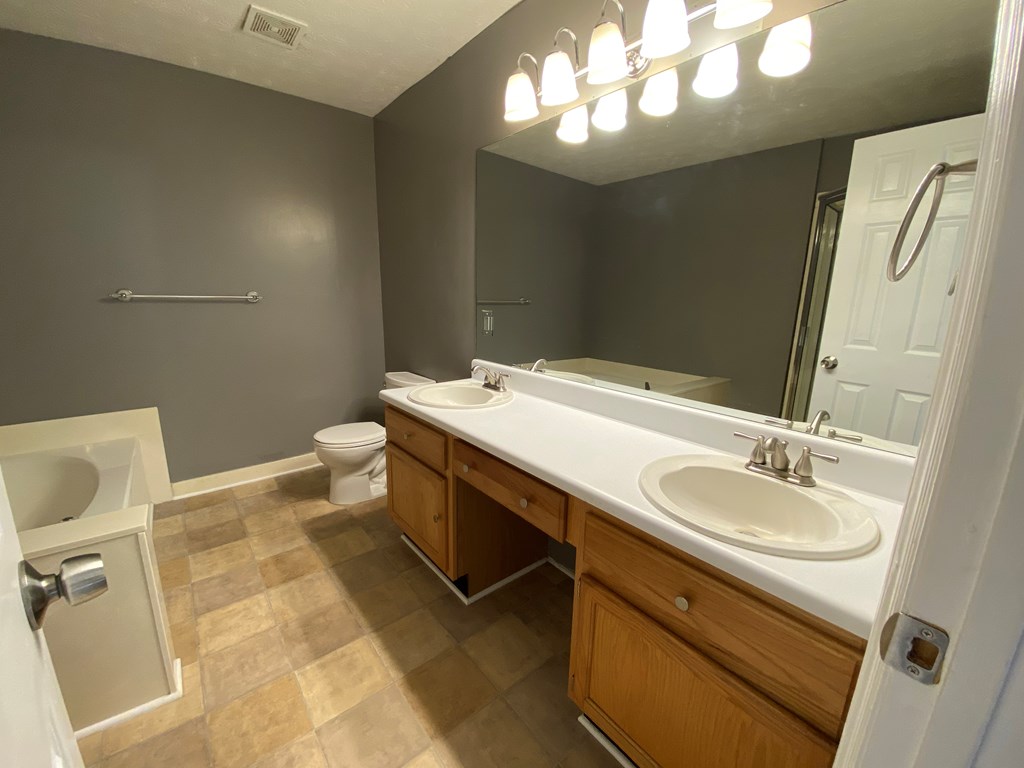 501 Hardy Road LaGrange, GA 30241 - Photo 18 of 37 a bathroom with a sink a toilet and a mirror