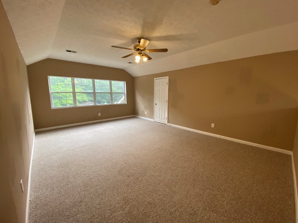 501 Hardy Road LaGrange, GA 30241 - Photo 31 of 37 an empty room with windows and ceiling fan view