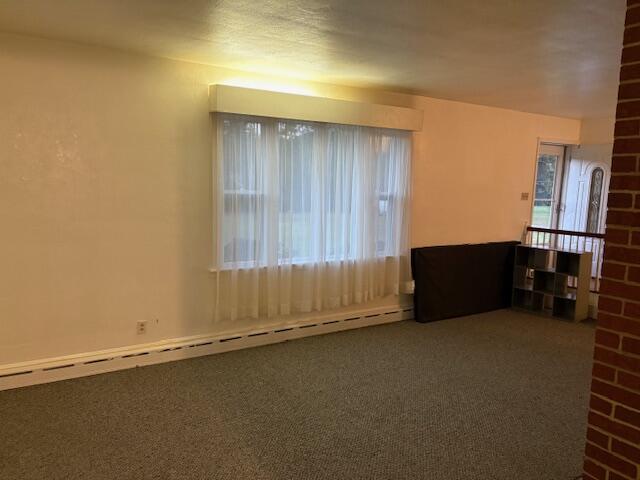 2356 West Riverside Drive Salem, VA 24153 - Photo 14 of 22 an empty room with wooden floor and furniture