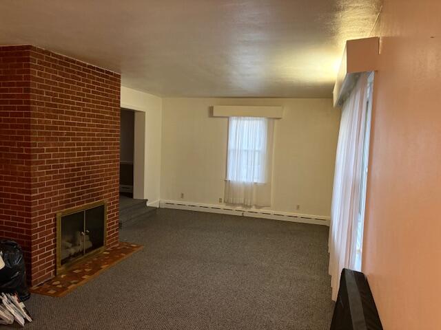 2356 West Riverside Drive Salem, VA 24153 - Photo 6 of 22 a view of an empty room with a fireplace and a window