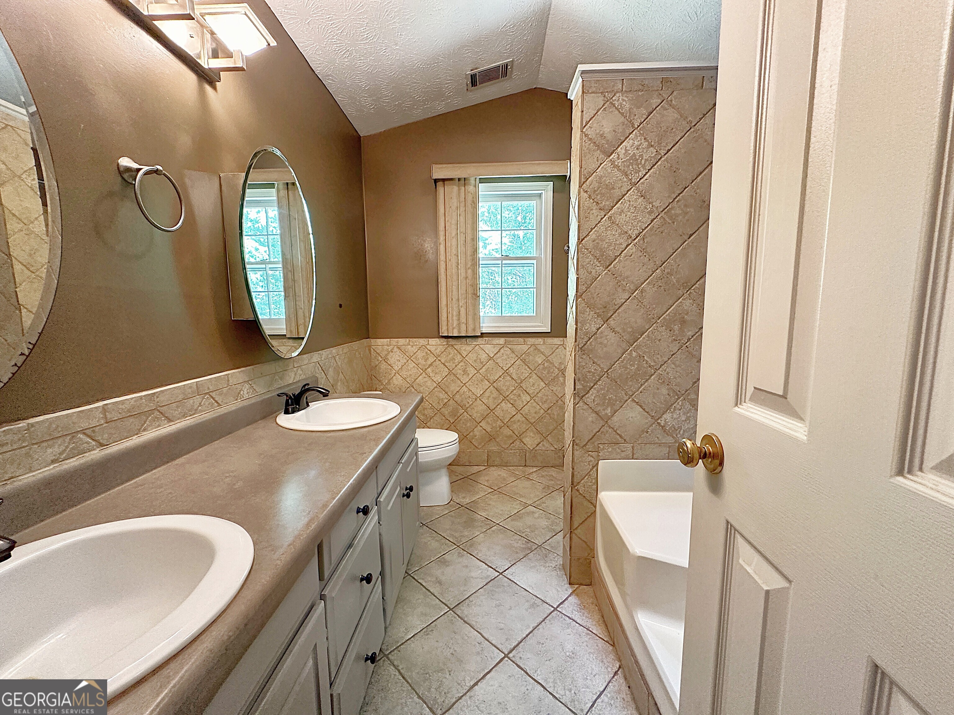 112 Greenbriar Trail LaGrange, GA 30241 - Photo 14 of 29 a bathroom with a granite countertop sink and a mirror