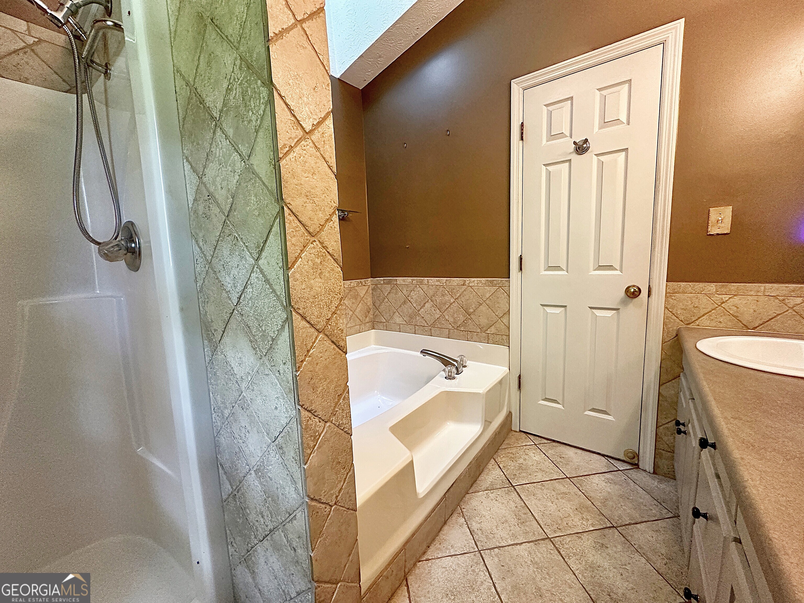 112 Greenbriar Trail LaGrange, GA 30241 - Photo 15 of 29 a bathroom with a tub sink and shower