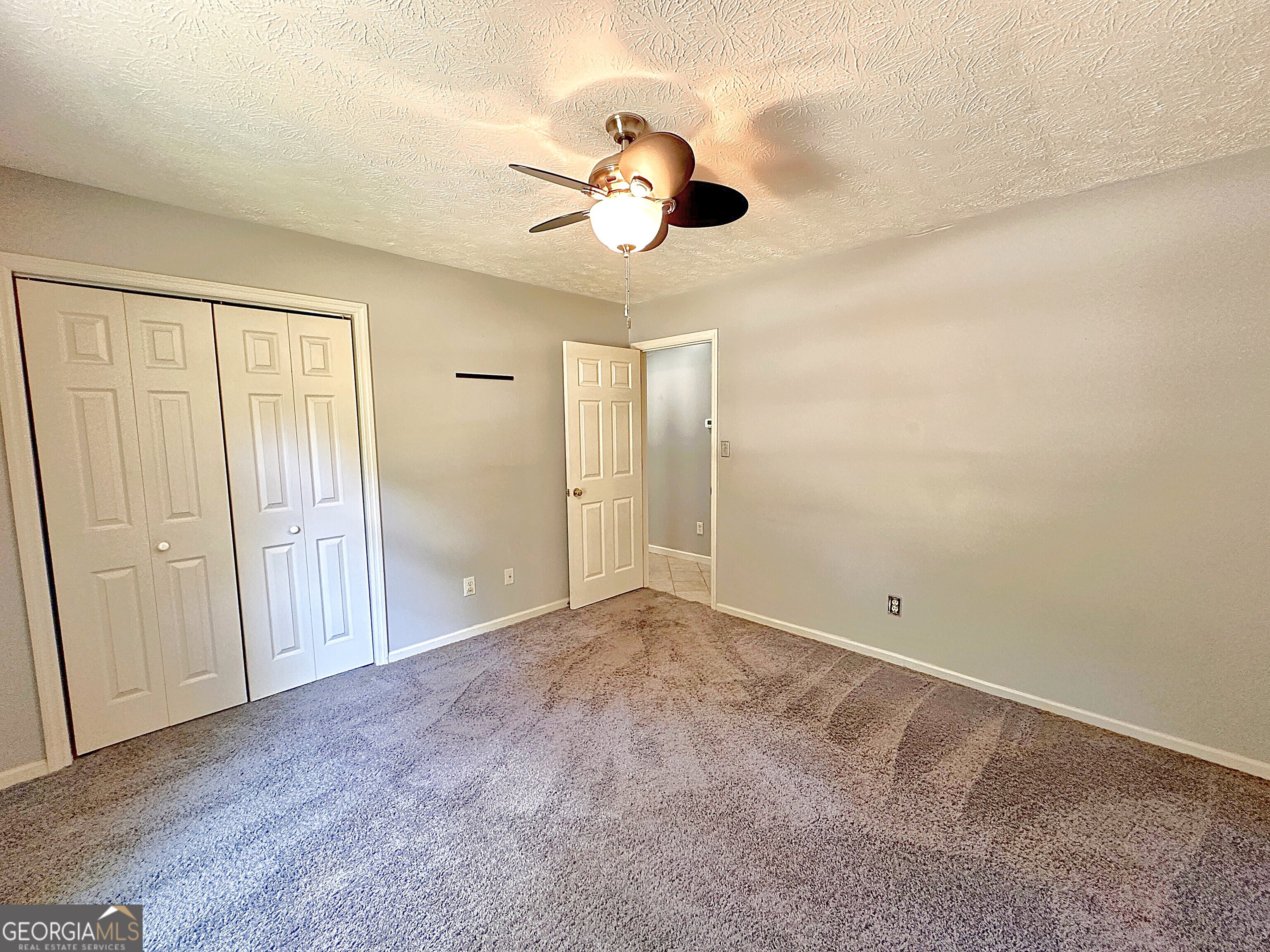 112 Greenbriar Trail LaGrange, GA 30241 - Photo 18 of 29 a view of an empty room with a chandelier fan