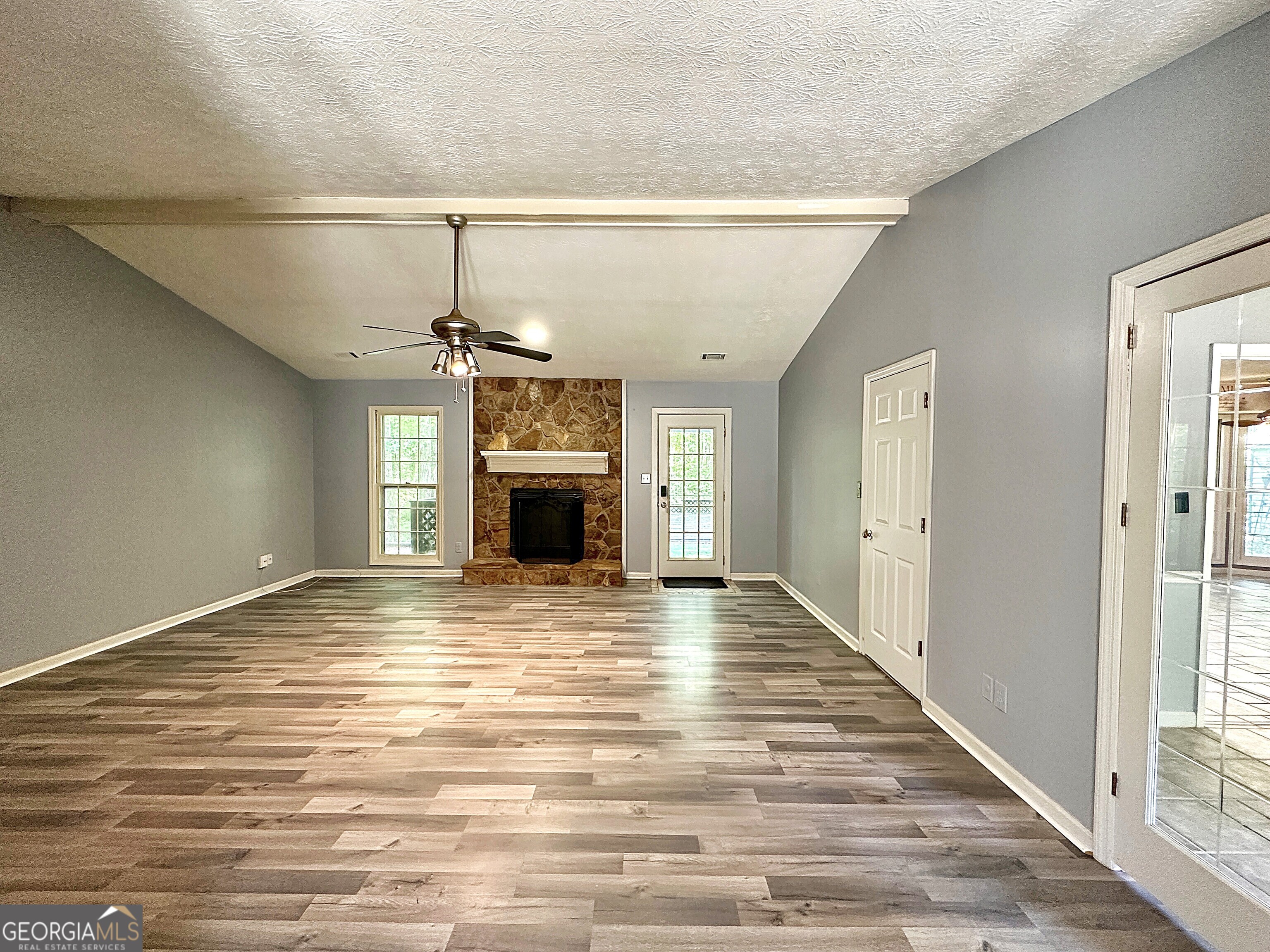 112 Greenbriar Trail LaGrange, GA 30241 - Photo 3 of 29 a view of empty room with fireplace and windows