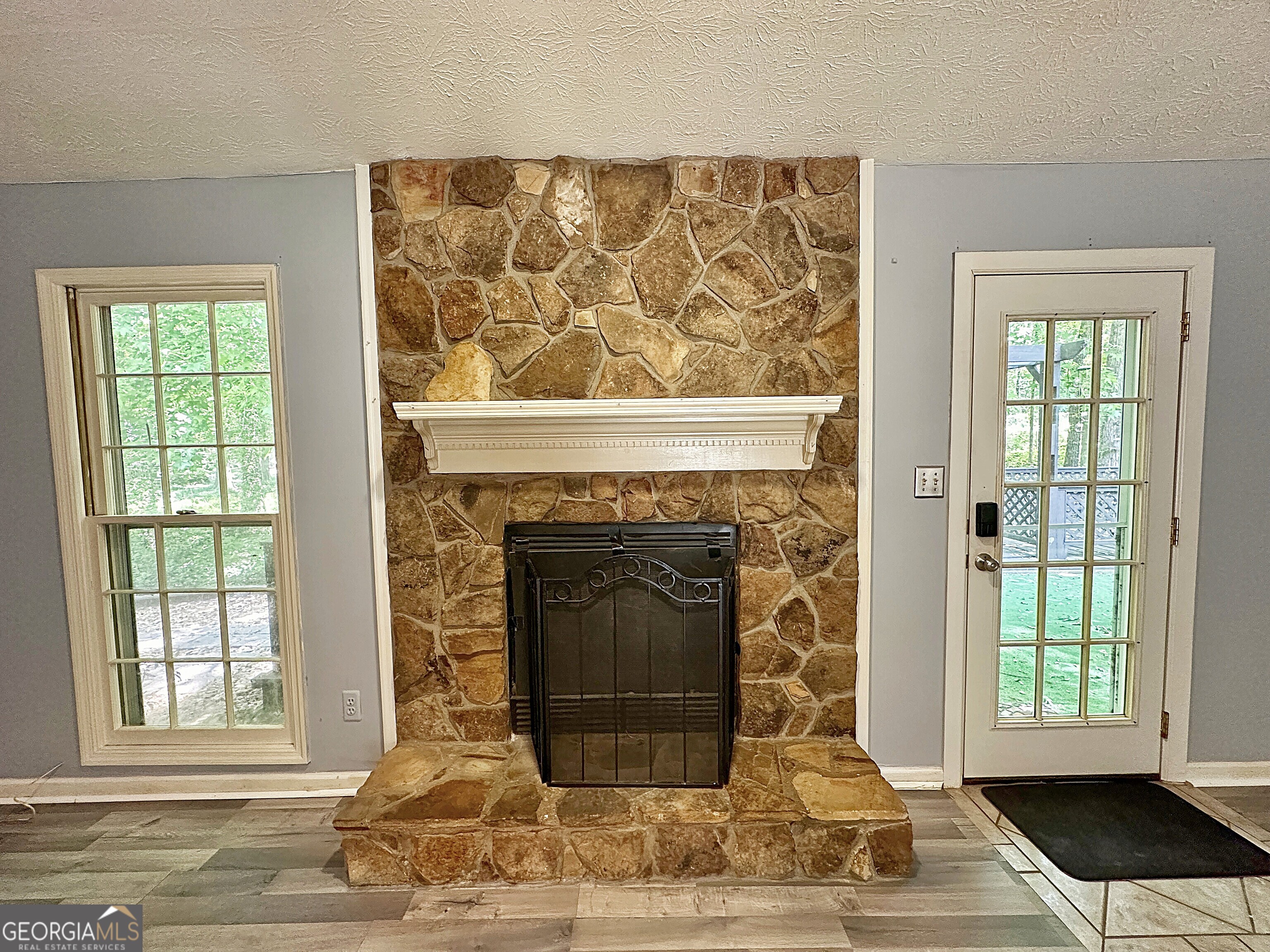 112 Greenbriar Trail LaGrange, GA 30241 - Photo 5 of 29 a living room with a fireplace and a window