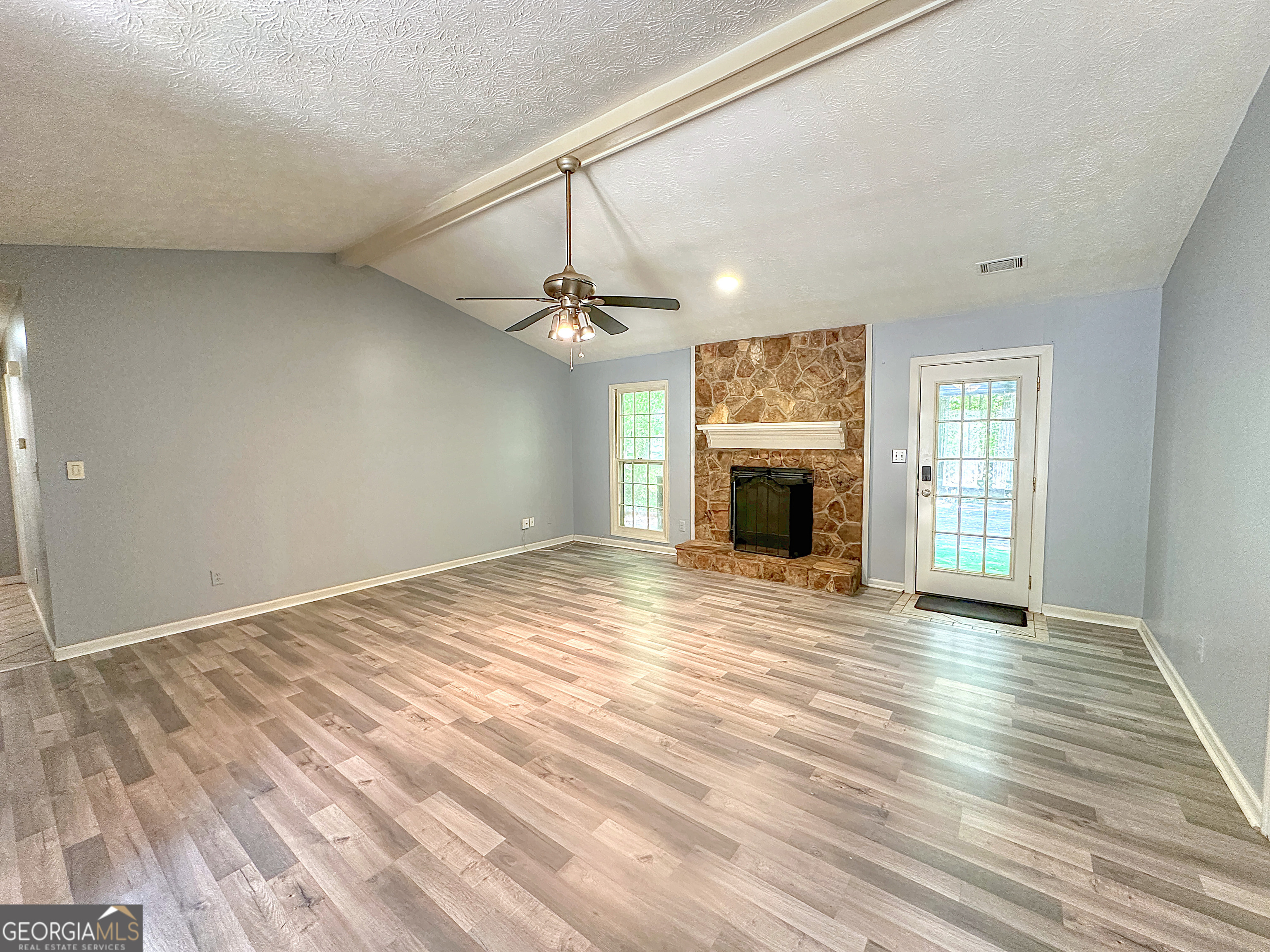 112 Greenbriar Trail LaGrange, GA 30241 - Photo 6 of 29 a view of empty room with wooden floor and fireplace