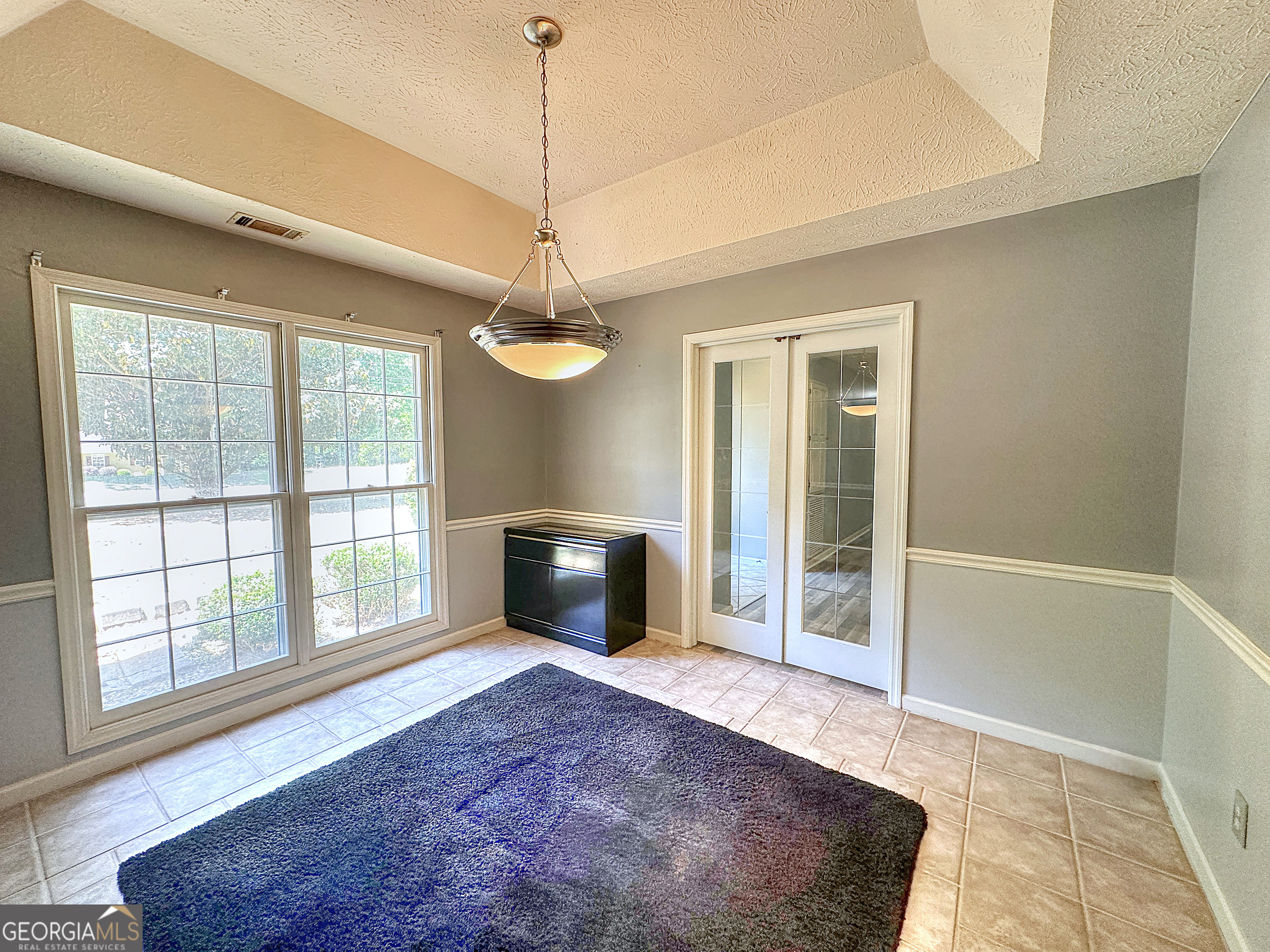 112 Greenbriar Trail LaGrange, GA 30241 - Photo 9 of 29 a view of an empty room with a fireplace and a window