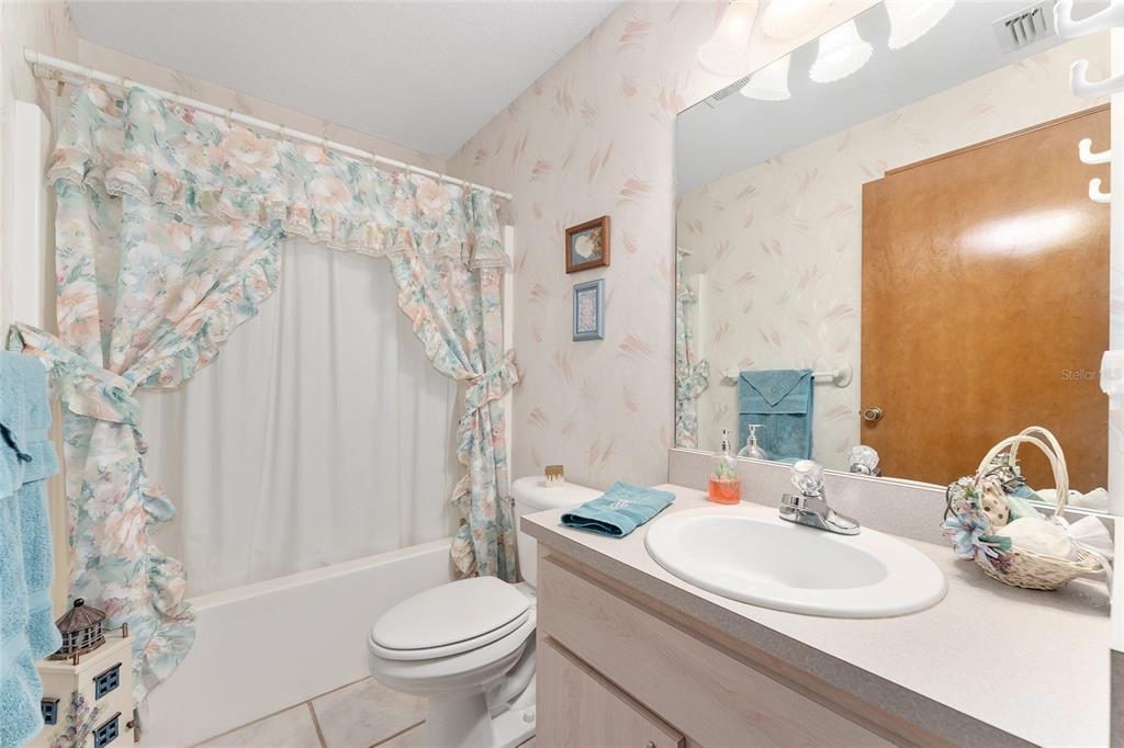 12681 Southeast 54th Avenue Belleview, FL 34420 - Photo 21 of 46 a bathroom with a sink toilet and shower