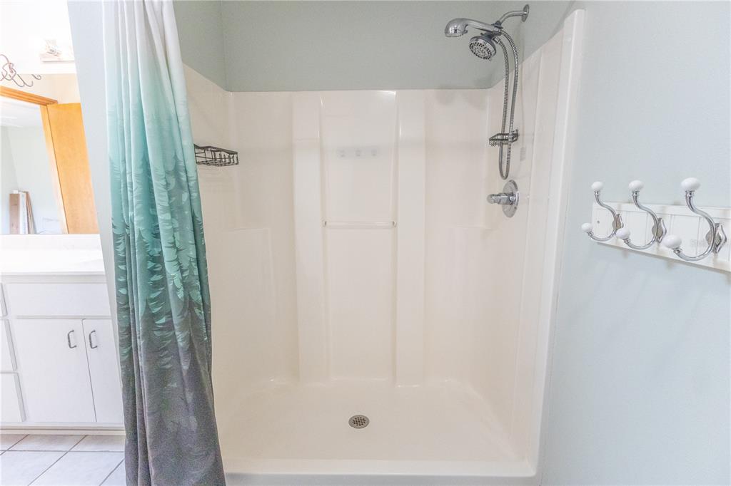 12681 Southeast 54th Avenue Belleview, FL 34420 - Photo 30 of 46 a bathroom with a shower