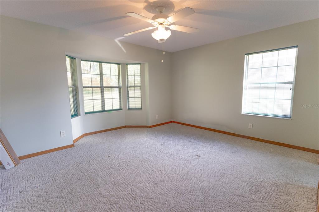 12681 Southeast 54th Avenue Belleview, FL 34420 - Photo 34 of 46 a view of an empty room with a window