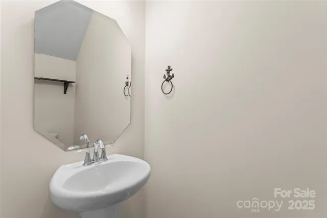 a bathroom with a sink and mirror