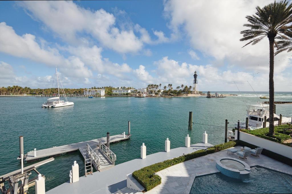 2400 Bay Drive Pompano Beach, FL 33062 - Photo 17 of 55 a view of a lake with couches chairs and city view