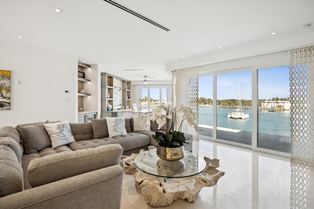 2400 Bay Drive Pompano Beach, FL 33062 - Photo 32 of 55 a living room with furniture kitchen view and a large window