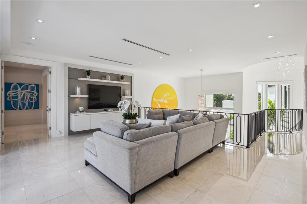 2400 Bay Drive Pompano Beach, FL 33062 - Photo 33 of 55 a living room with furniture and a flat screen tv